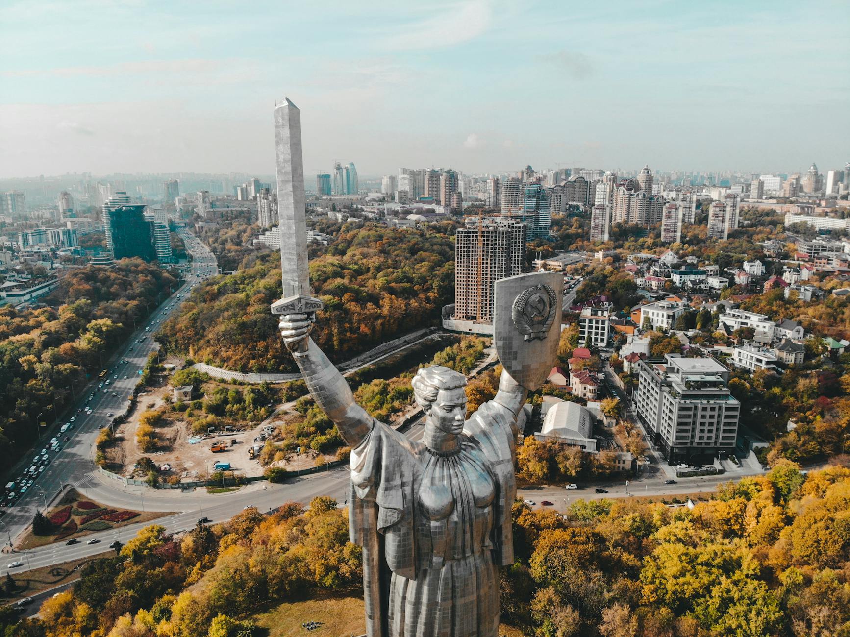 big statue over city in ukraine