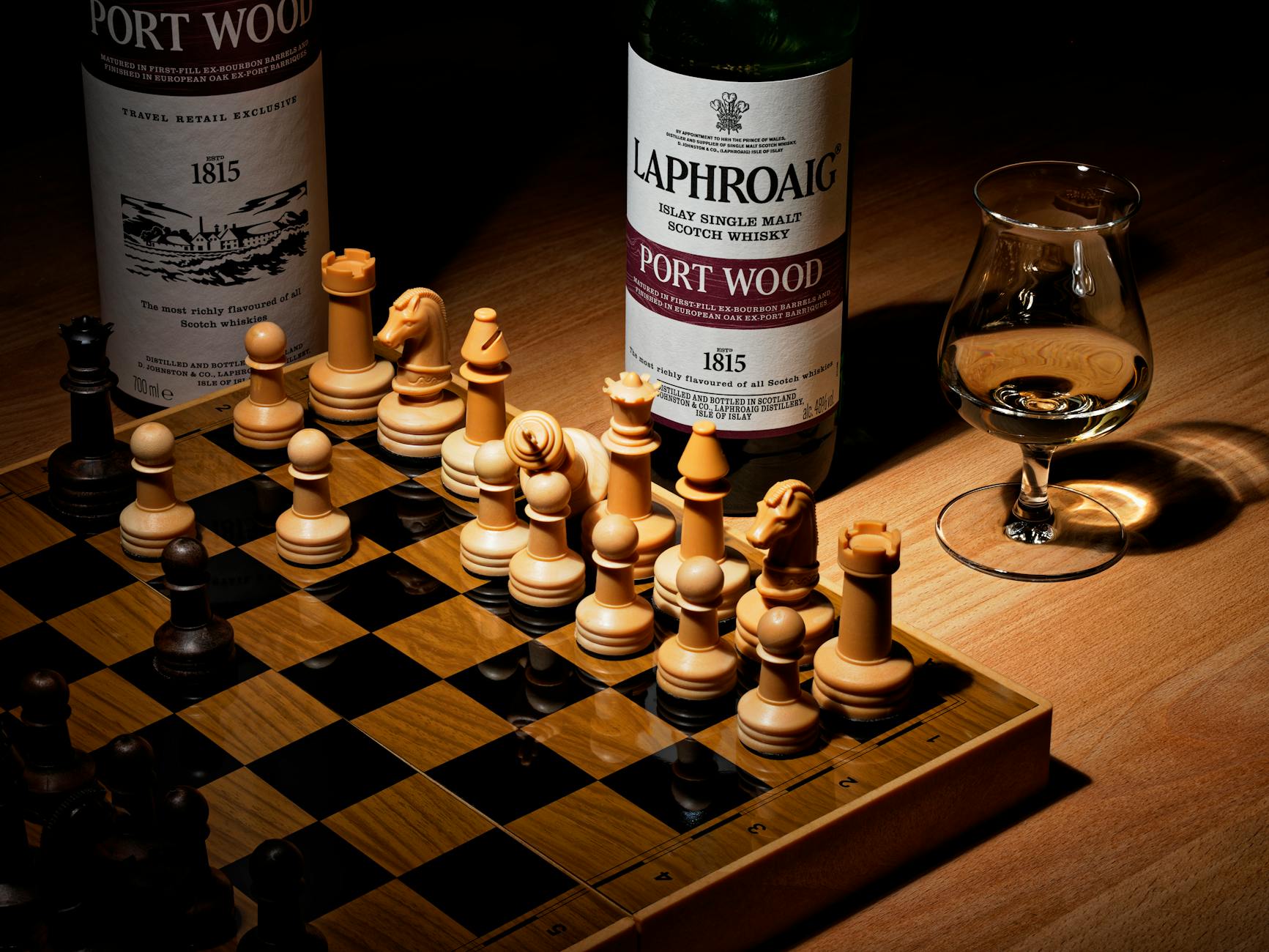 a chess board and liquor bottles on wooden table